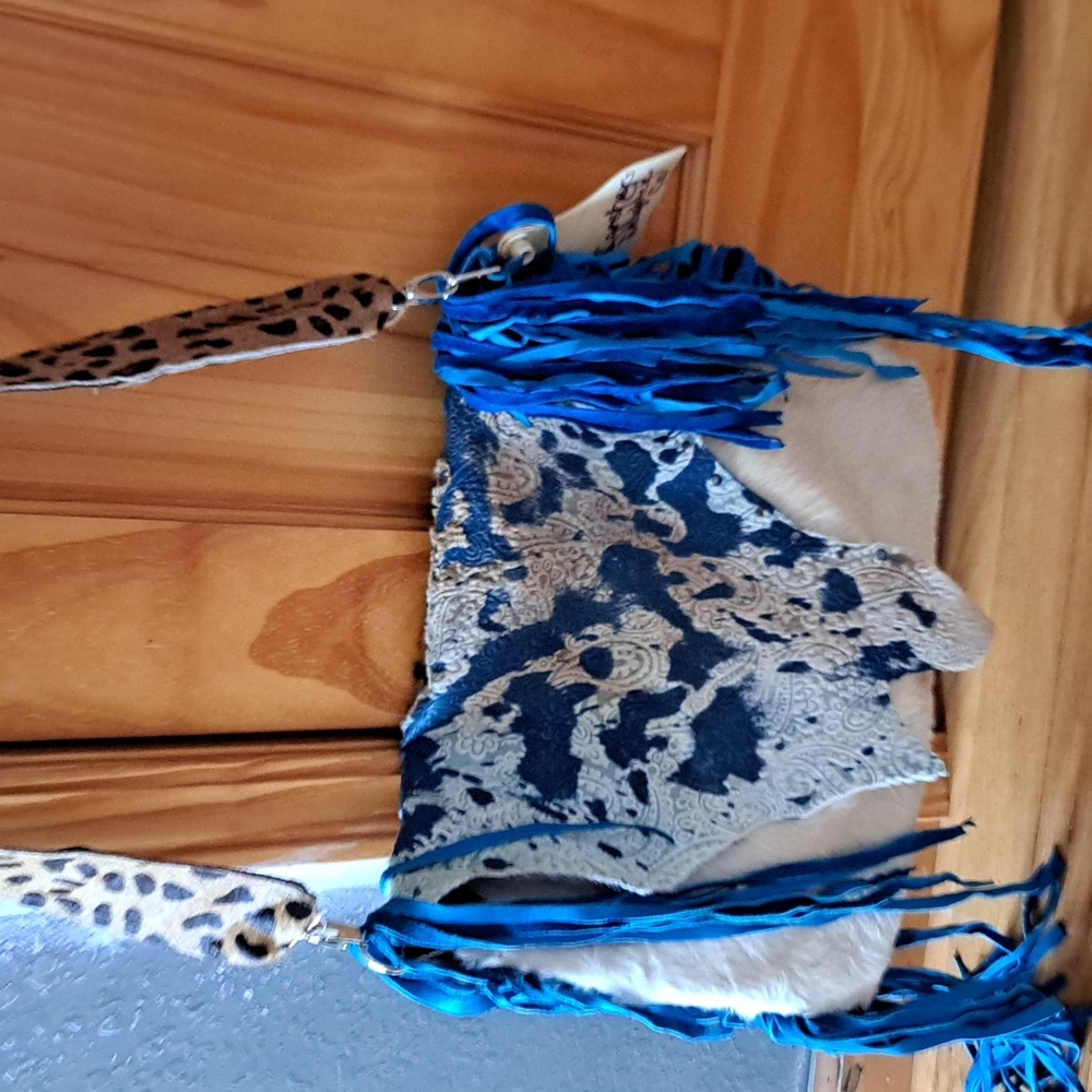 Handmade cowhide, dyed turquoise with fringe and leopard handbag